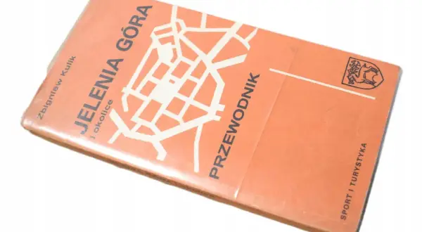 Przewodnik "Jelenia Góra co zobaczyć" autorstwa Zbigniewa Kulika. Na okładce mapa miasta i herb.